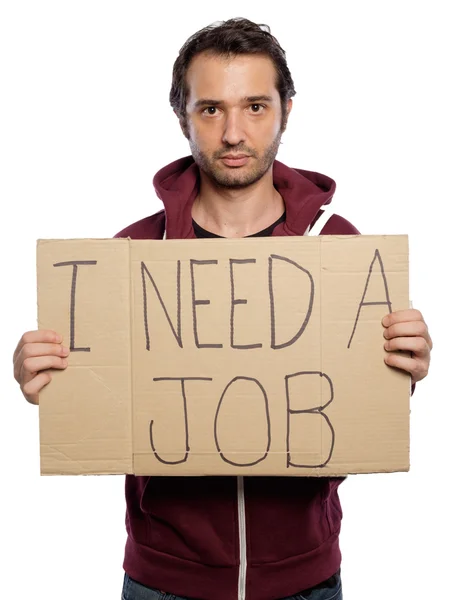 Unemployed man holding a cardboard isolated on white background — Stock Photo, Image