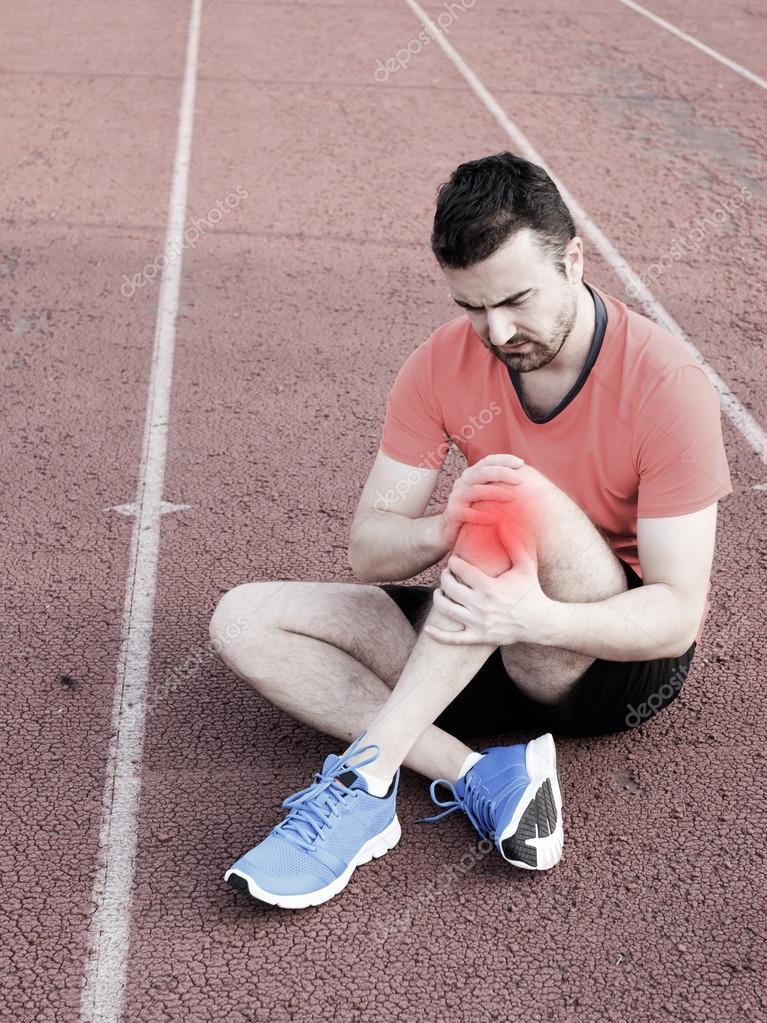 Runner with injured knee on the track — Stock Photo © tommaso1979 123908576