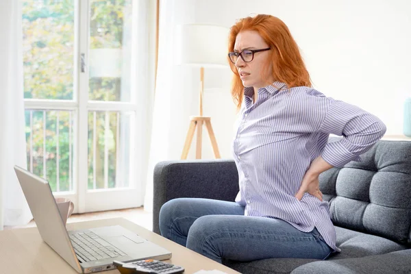 One Young Redhead Woman Suffers Back Pain Cramp Working Home — Stock Photo, Image