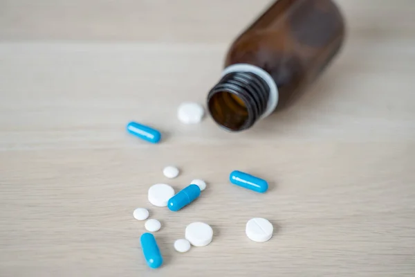 Antidepressant drugs meds, capsule and pills on table