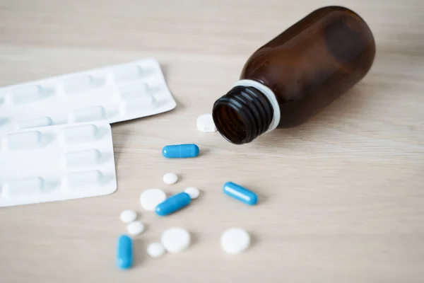 Antidepressant drugs meds, capsule and pills on table