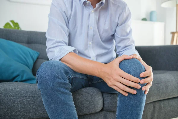 Painful knee injury symptom after sitting on the sofa