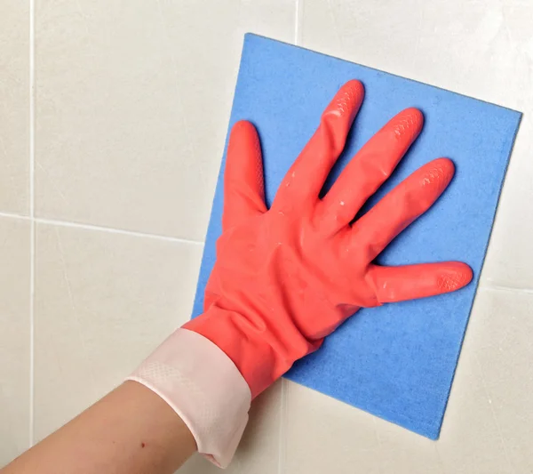 Cleaning glove and sponge on tiles — Stock Photo, Image