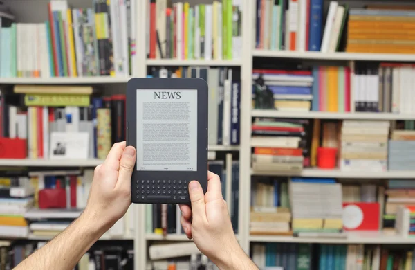 E-book reader in hands — Stock Photo, Image