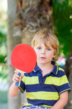 Little kid boy with table tennis racquet