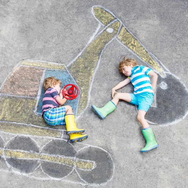 Two little kid boys with excavator chalk picture — Stock Photo, Image