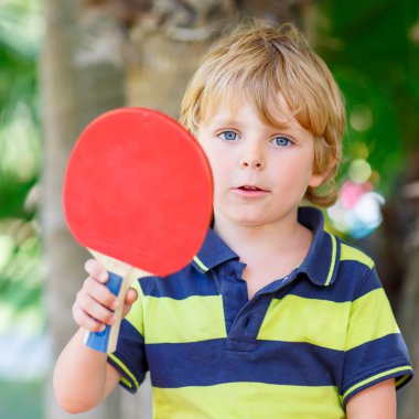 Little kid boy with table tennis racquet
