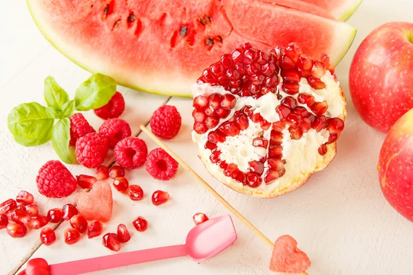 Organic fruits and berrys: rapsberyy, watermelon, pomegranate — Stock Photo, Image
