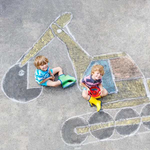 Two little kid boys with excavator chalk picture — Stock Photo, Image