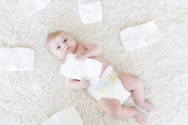 Newborn baby girl with diapers. Dry skin and nursery — Stock Photo, Image