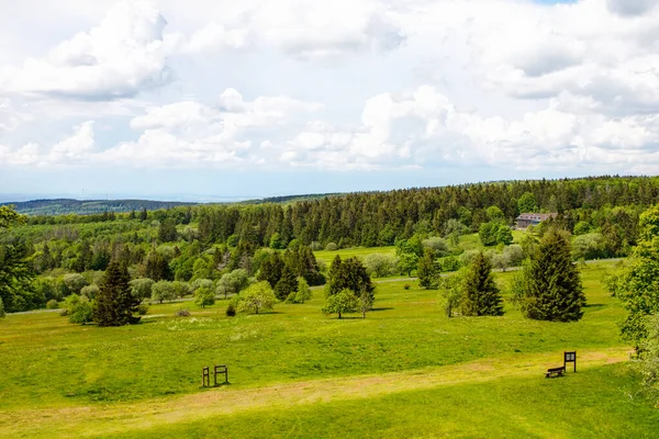 Landscape on Hoherodskopf, volcano region in Hesse, Germany. On cloudy sunny warm summer day, meadows, hills, fields and forests. — Stock Photo, Image