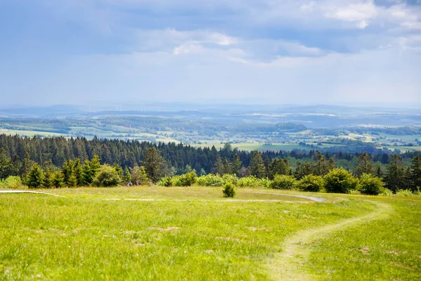 Landscape on Hoherodskopf, volcano region in Hesse, Germany. On cloudy sunny warm summer day, meadows, hills, fields and forests. — Stock Photo, Image