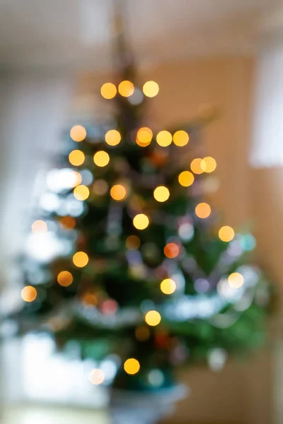 Bokeh lights illumination on decorated Christmas tree. Xmas holiday. — Stock Photo, Image