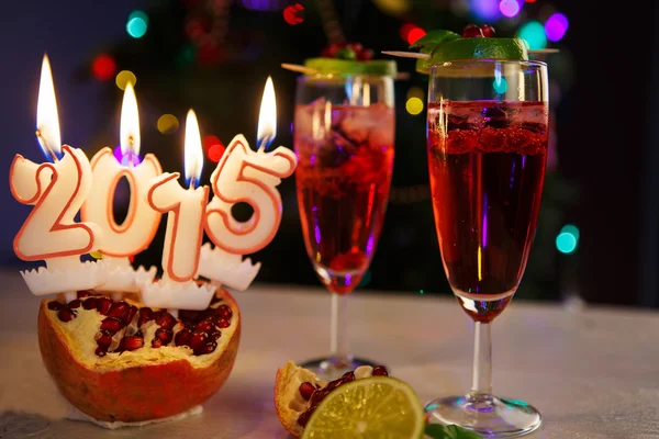 Two glasses with red champagne and candles 2015 — Stock Photo, Image