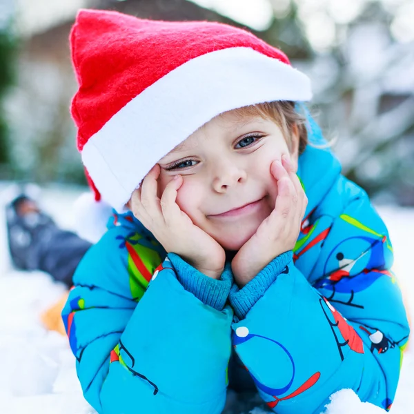 Happy little toddler boy waiting for Christmas santa hat — Stock Photo, Image