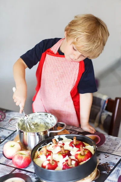 Adorable little boy helping and baking apple pie in home''s kitc — Stock Photo, Image