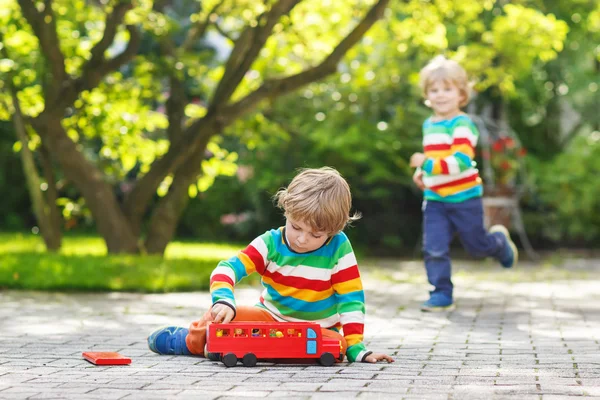 Little preschool boy playing with car toy — Stock Photo, Image