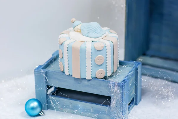 Baby birthday cake in soft blue and white