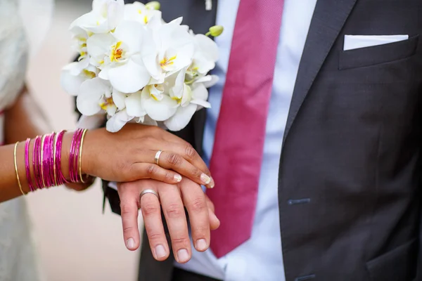 Hands of man and woman with rings and traditional indian jewelry — Stock Photo, Image