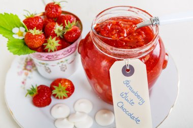 Strawberry jam with white chocolate, home made in jar clipart