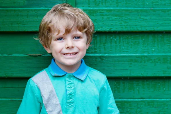 Portrait of happy little cute kid boy with blond hairs and blue — Stock Photo, Image