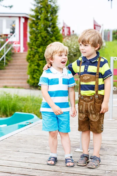 Two happy adorable little friends boys hugging — Stock Photo, Image