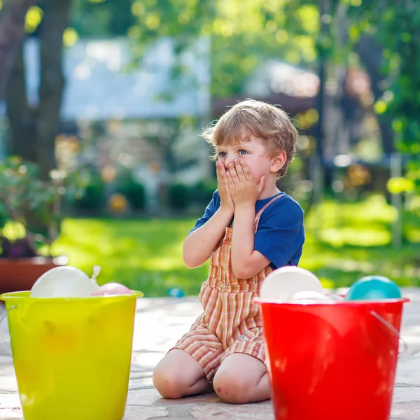 Little toddler boy having fun with splashing water in summer gar — Stock Photo, Image