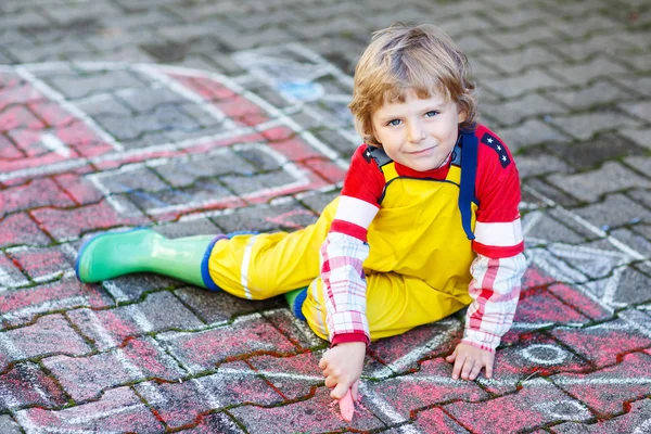 Funny adorable child of four years having fun with fire truck pi — Stock Photo, Image