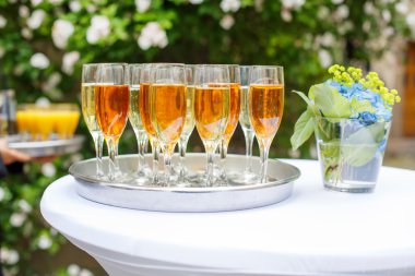 Dish with champagne and wine glasses clipart
