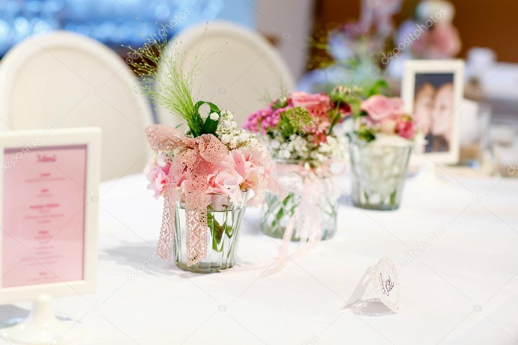 Table set in pink and white for wedding or event party. 