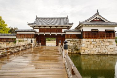 Old Hiroshima casle in Japan, on Otagawa river in summer.