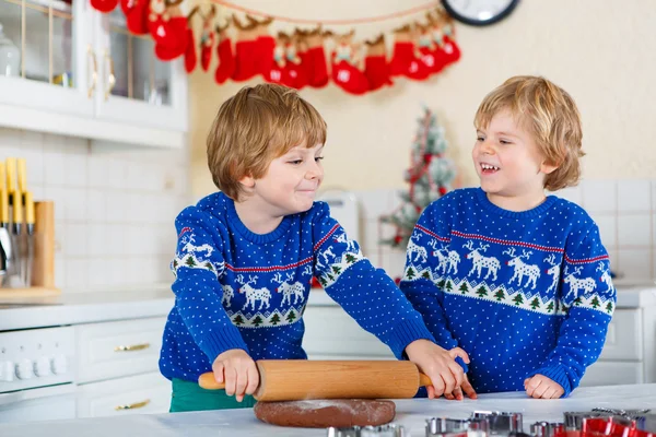 Two little kid boys baking gingerbread cookies — Stok fotoğraf