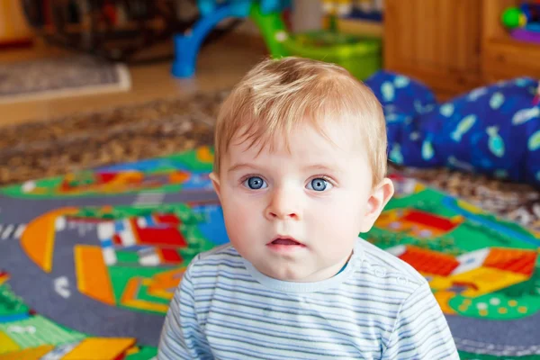 Little baby playing with different toys indoors — Stock Photo, Image
