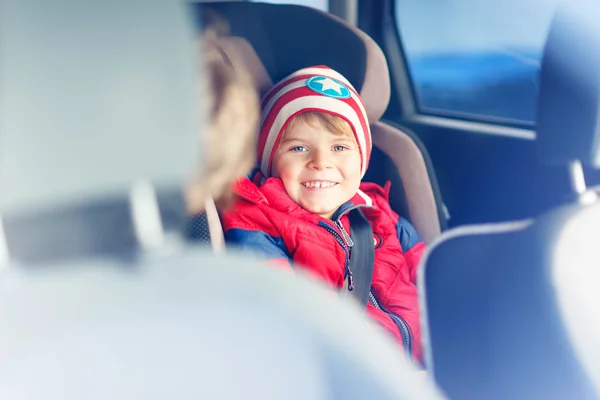 Portrait of preschool kid boy sitting in car — Stock Photo, Image