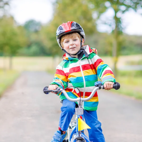 Cute active little boy riding on bike — Stock Photo, Image