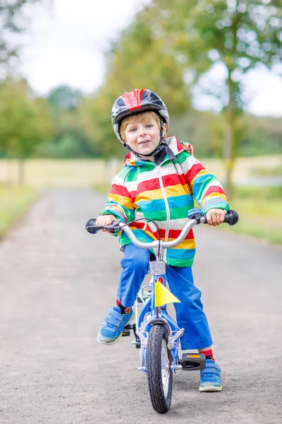 Cute active little boy riding on bike — Stock Photo, Image