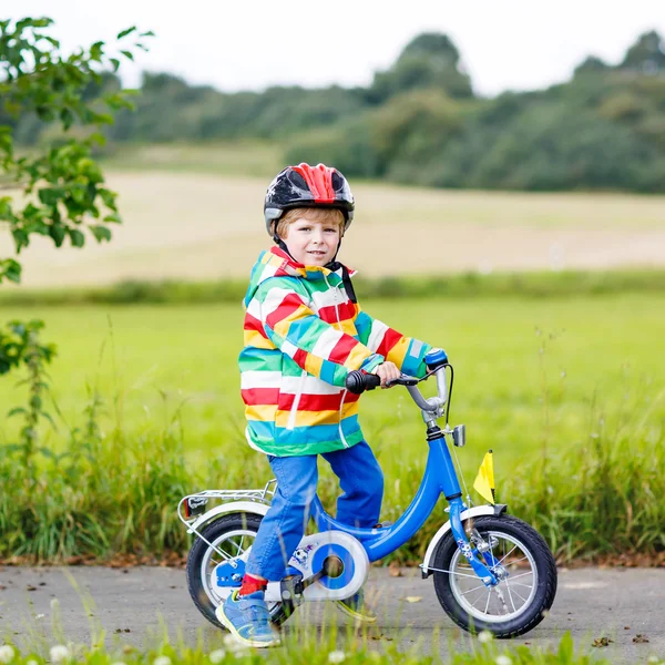 Cute active little boy riding on bike — Stock Photo, Image