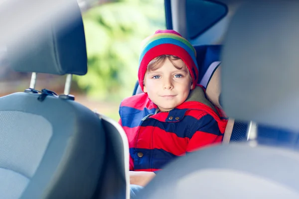 Portrait of preschool kid boy sitting in car — Stock Photo, Image