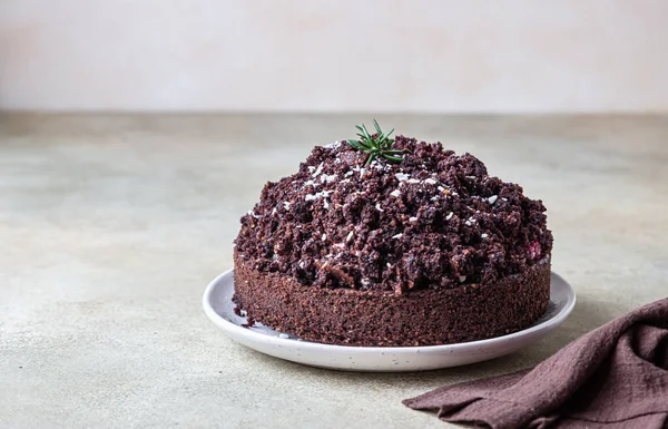 Homemade chocolate cake with cherry and whipped cream. Cake Mink mole or Mole hole cake. Selective focus.