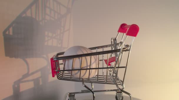 Egg with shopping cart — Stock Video