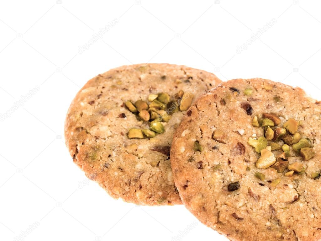 Almond and Pistachio Cookies or Biscuits Against a White Background