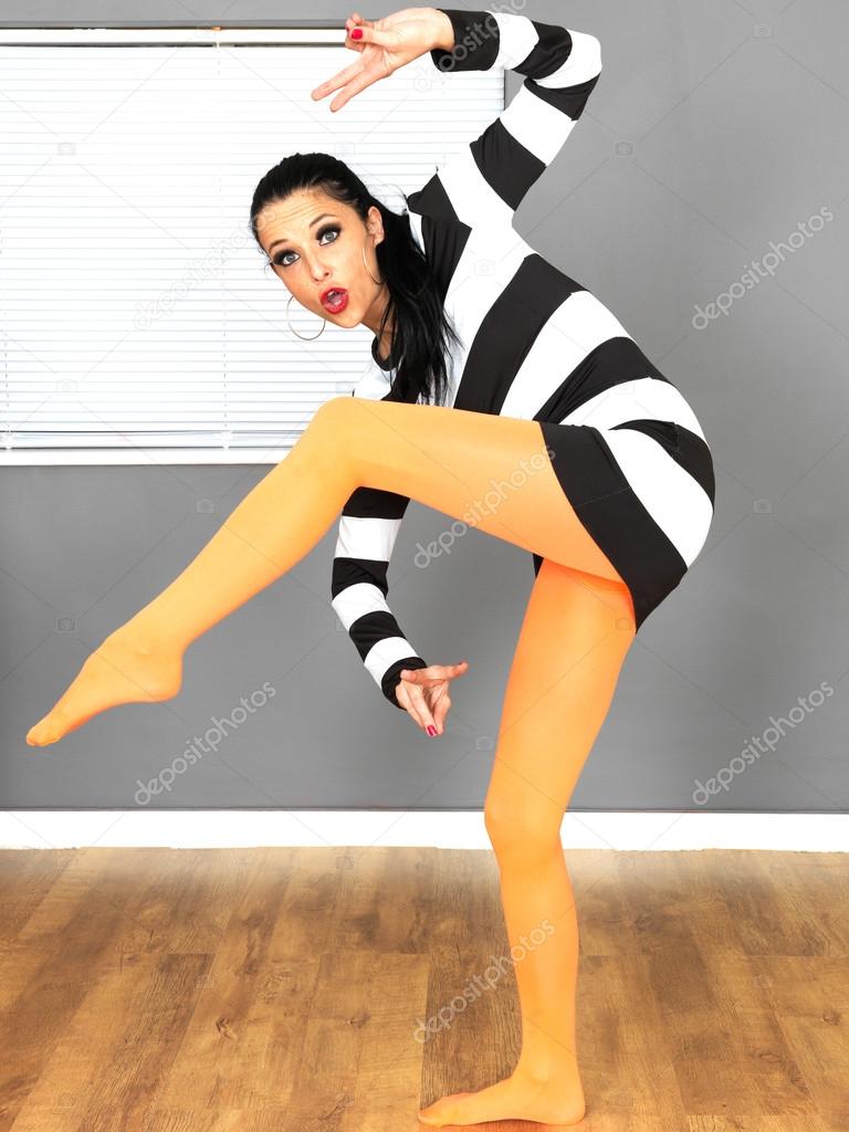 Sexy Young Woman Wearing a Mini Dress with Orange Tights