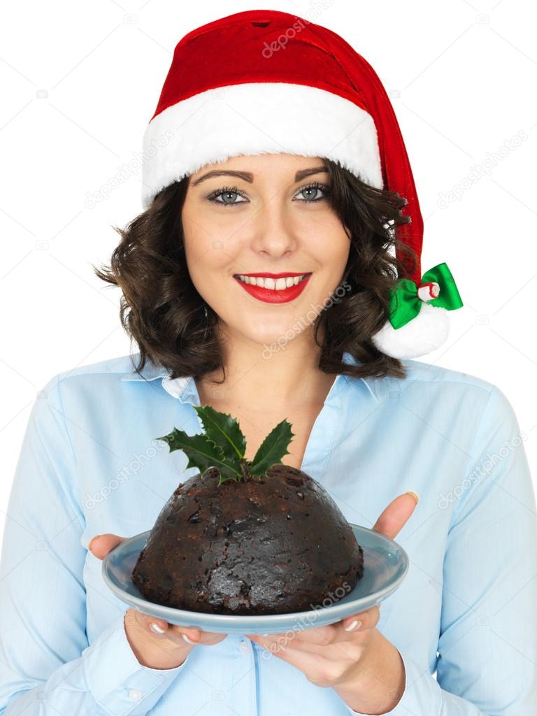 Young Woman in Santa Hat Holding a Traditional Christmas Pudding