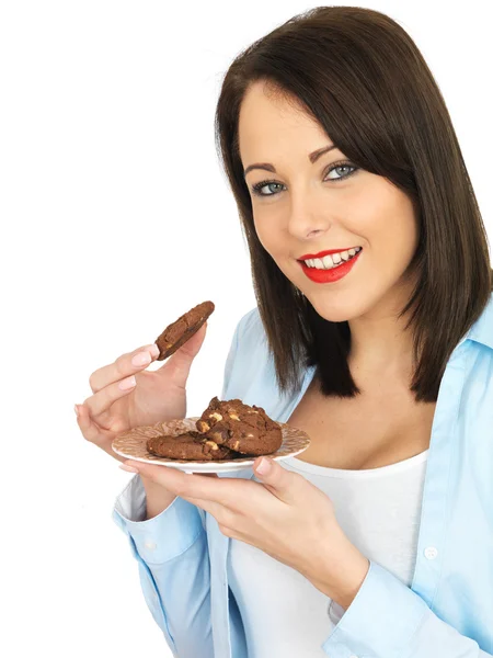 Mujer joven comiendo galletas —  Fotos de Stock