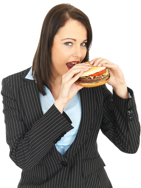 Young Business Woman Eating a Beef Burger — Stock Photo, Image