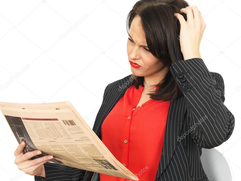 Young Business Woman Reading a Newspaper