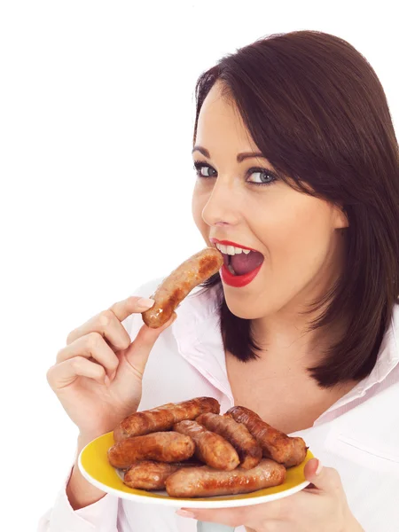 Young Woman Holding a Plate of Pork Sausages — Stock Photo, Image