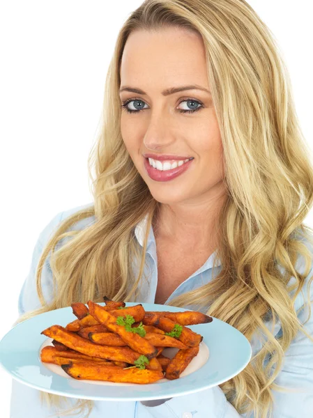 Young Woman Holding a Plate of Sweet Potatoes — Stock Photo, Image
