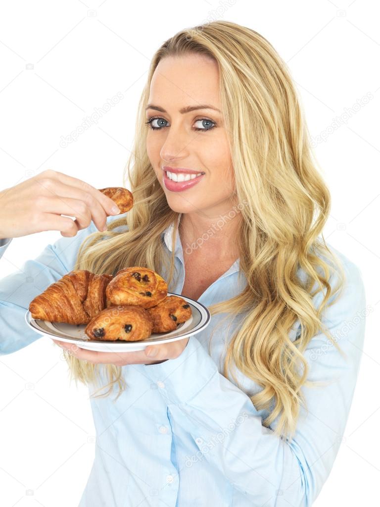 Young Woman Eating Danish Pastries