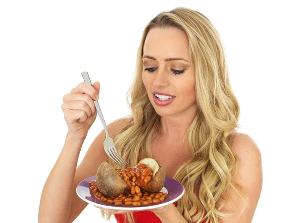 Young Woman Eating a Jacket Potato with Baked Beans — Stock Photo, Image